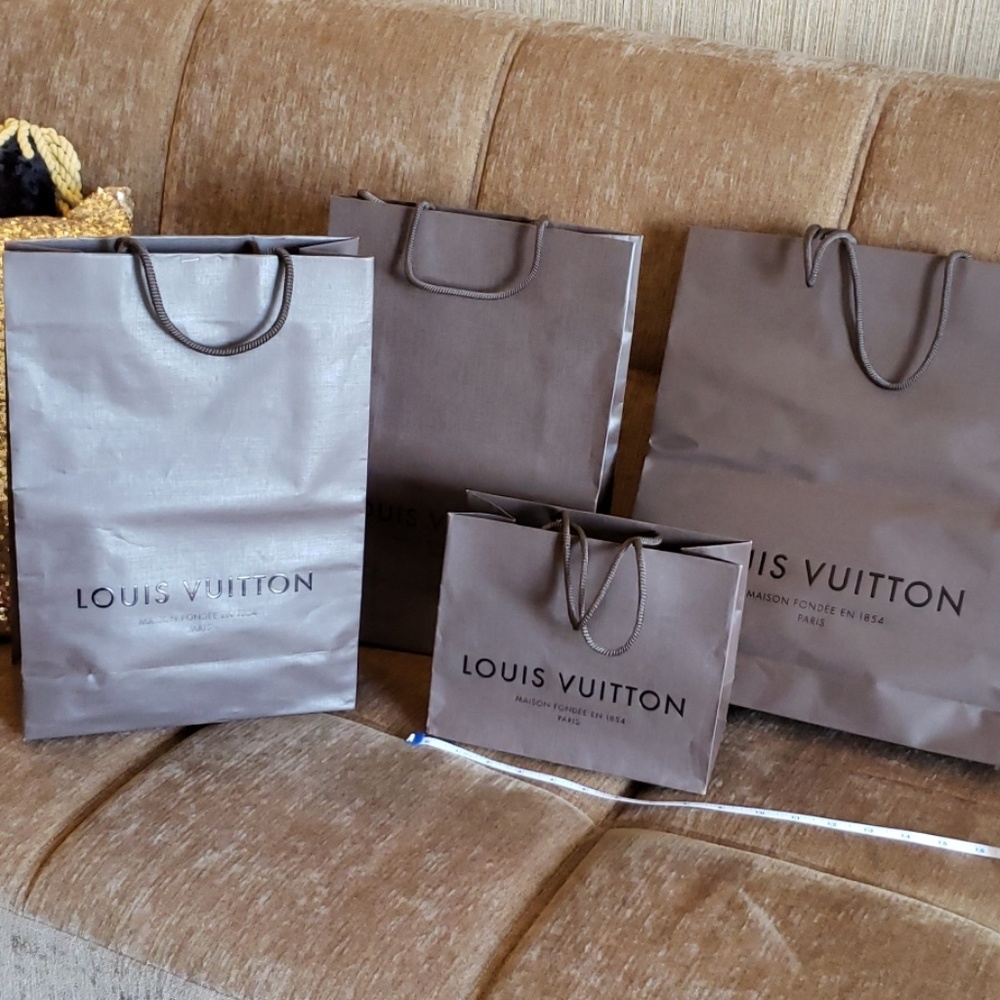 Each Louis Vuitton shopping bag sells separately